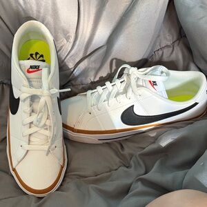 Nike Men's White and Black Sneakers with Gold Accents